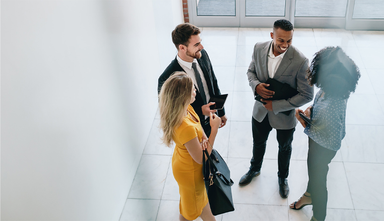 Group of business individuals having a conversation.